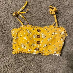 Floral swim top. Yellow with white flowers size medium
